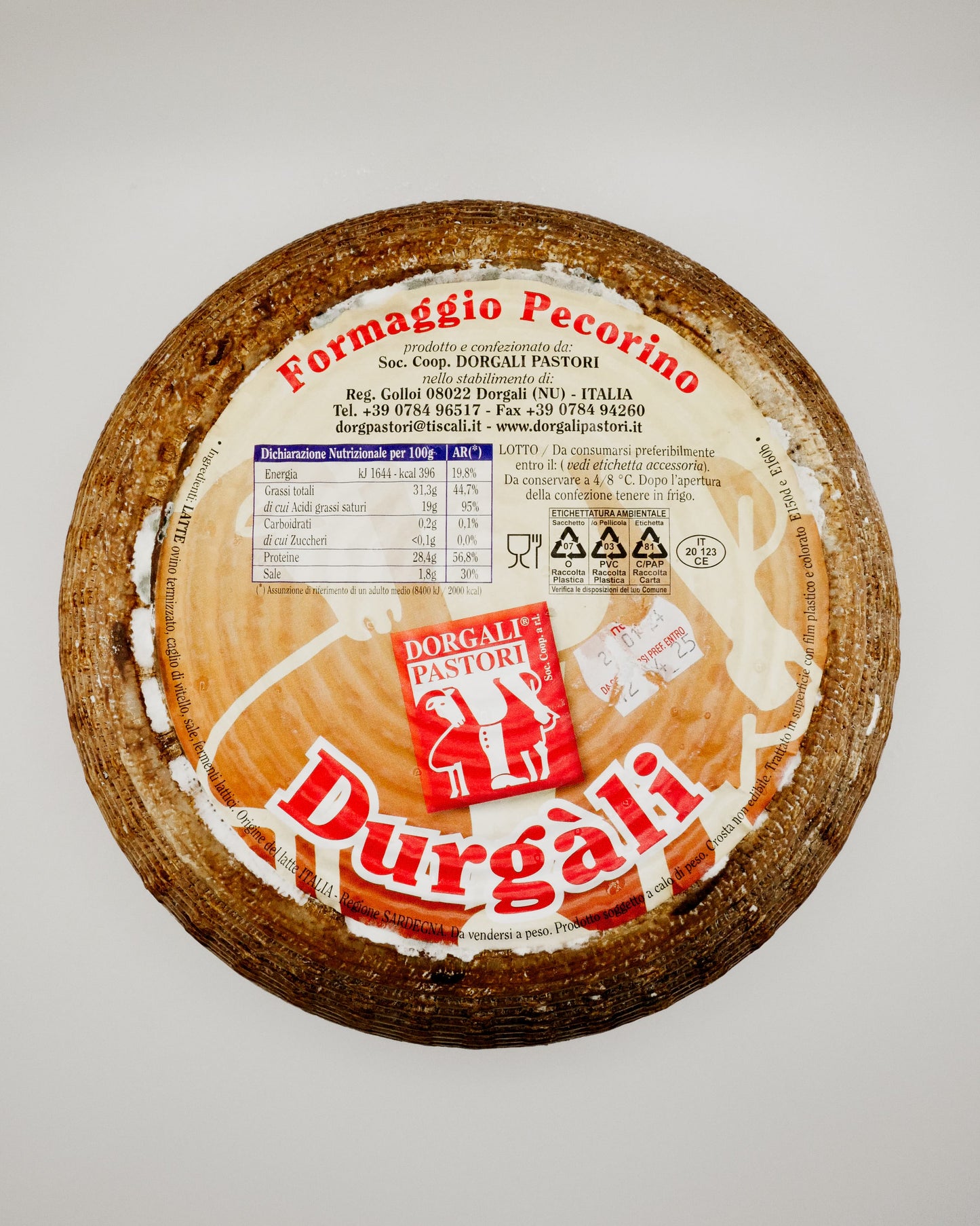 Round cheese with Durgali Pastori branding on a light gray background