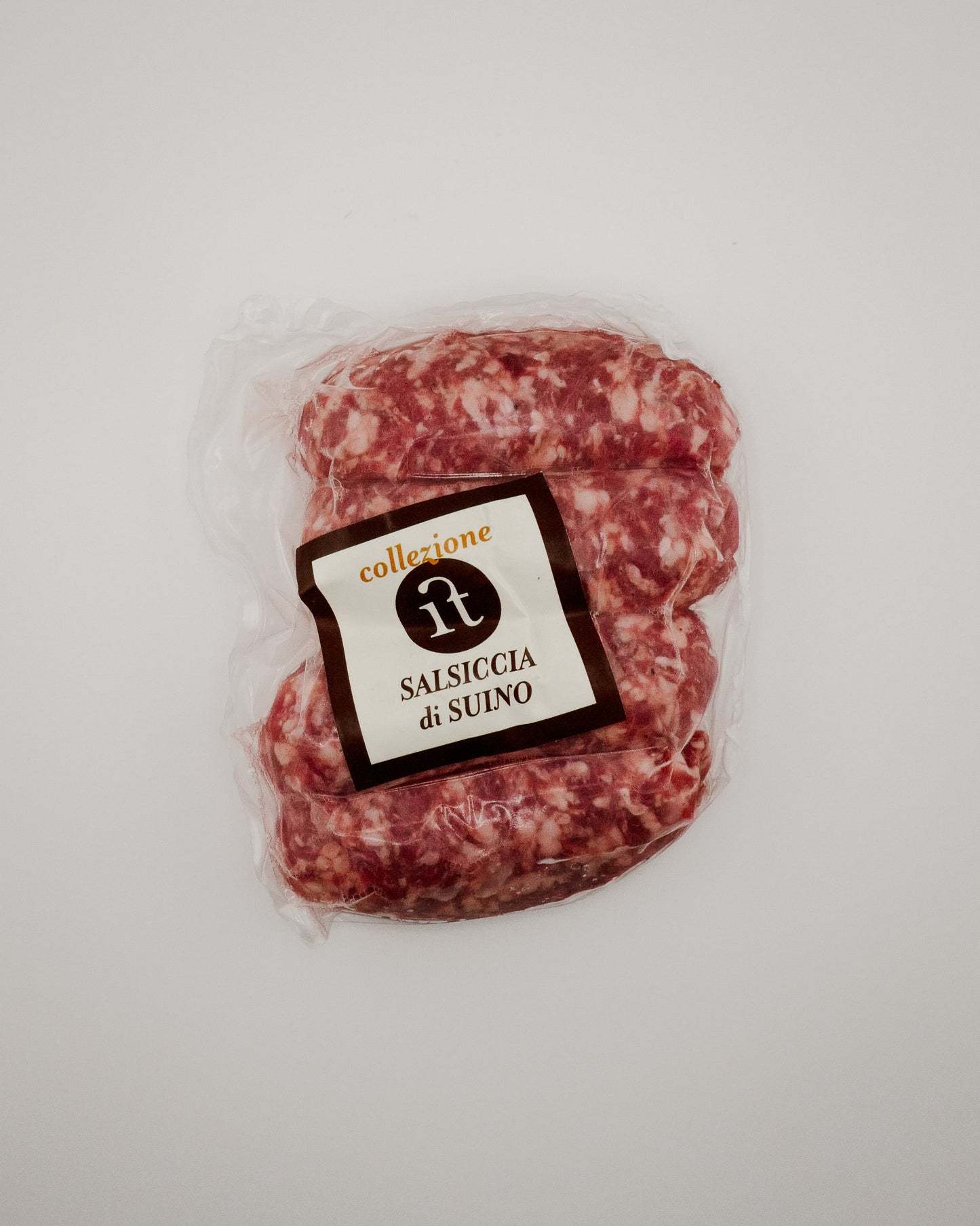 Packaged Tuscan Sausages with a label on a light gray background