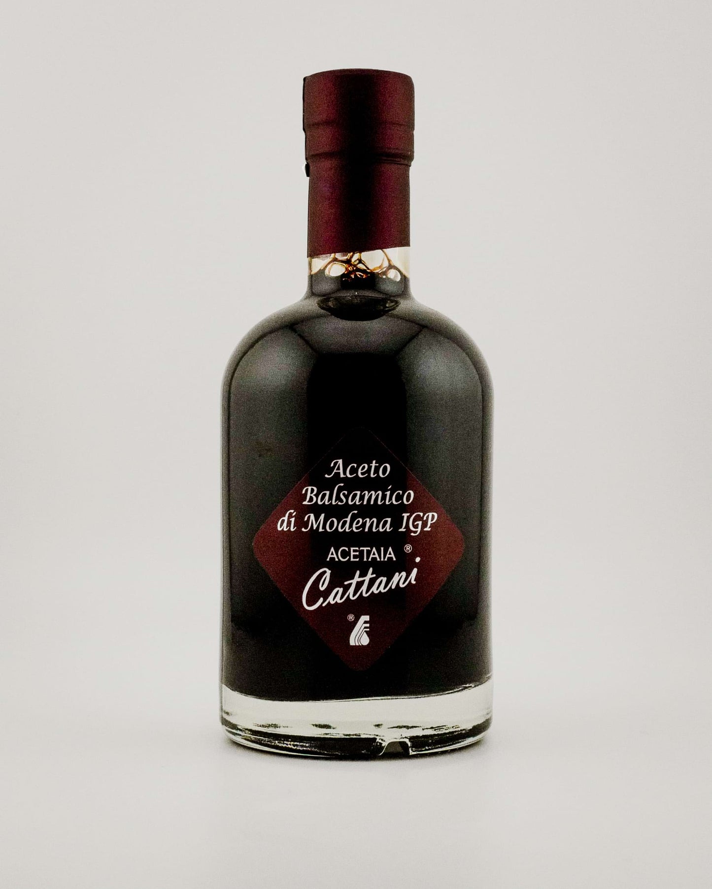 Bottle of Acetaia Cattani balsamic vinegar on a white background