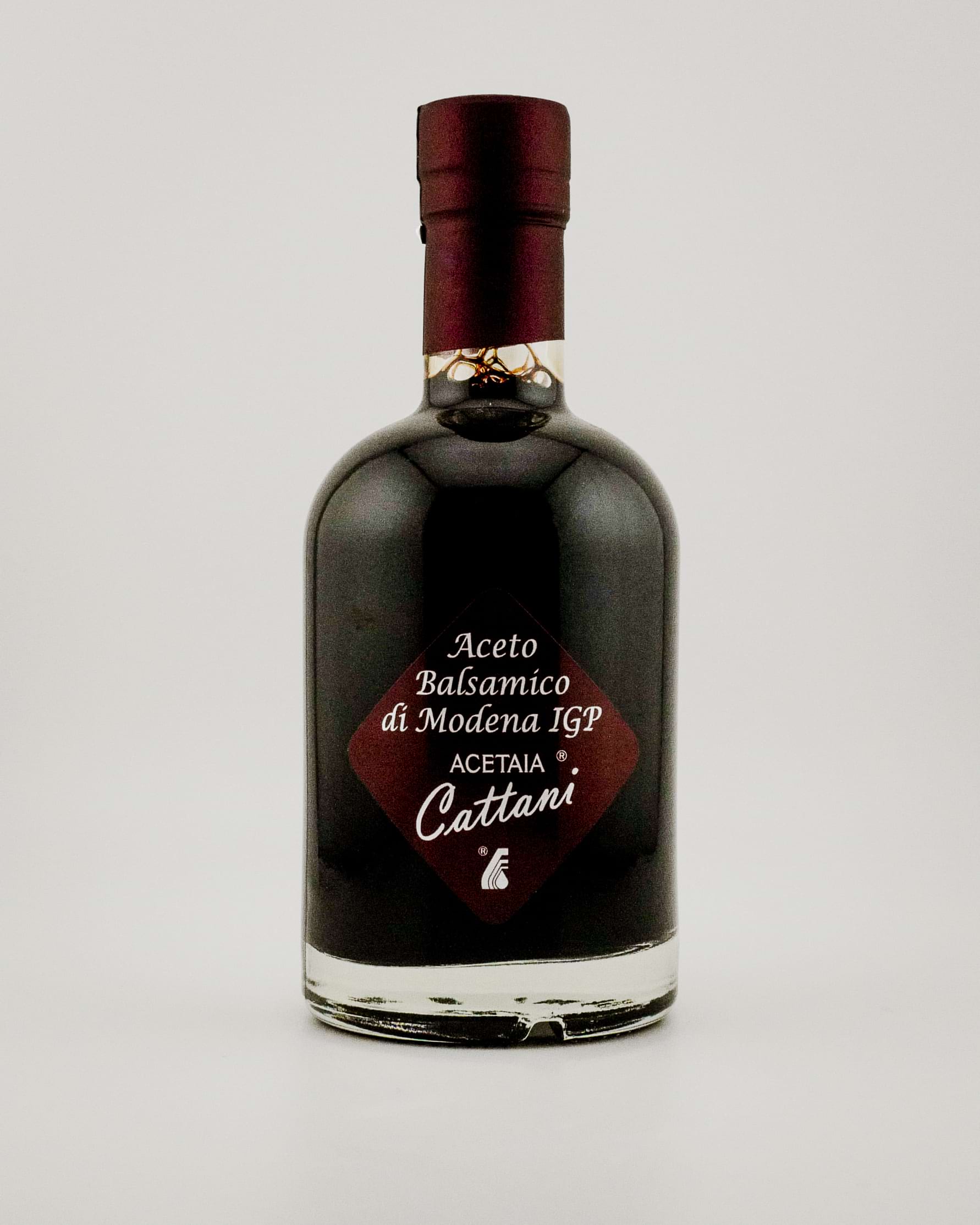 Bottle of Acetaia Cattani balsamic vinegar on a white background
