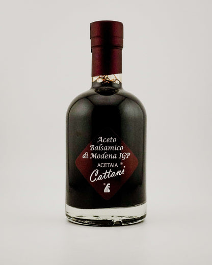 Bottle of Acetaia Cattani balsamic vinegar on a white background