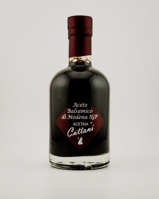 Bottle of Acetaia Cattani balsamic vinegar on a white background