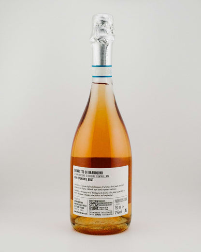 Bottle of Rosé wine with a label on a light gray background