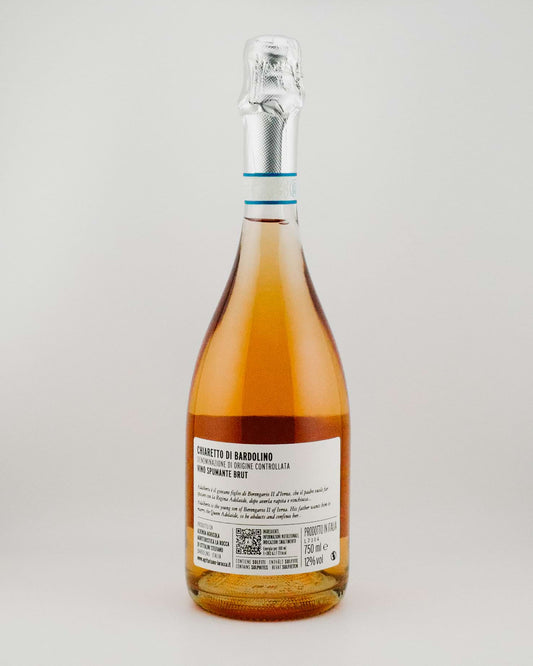 Bottle of Rosé wine with a label on a light gray background