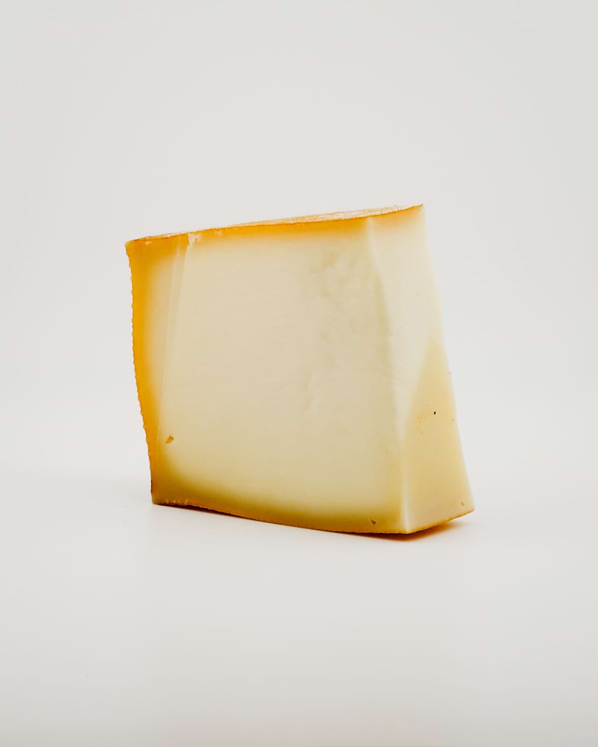  wedge of FONTAL cheese on a white background