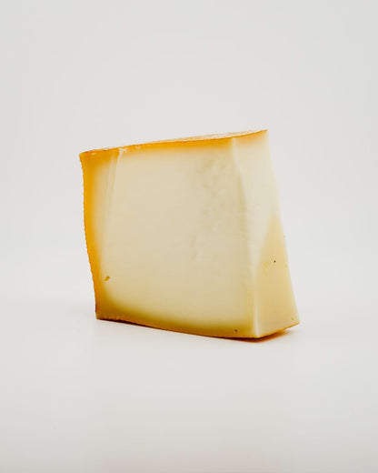  wedge of FONTAL cheese on a white background