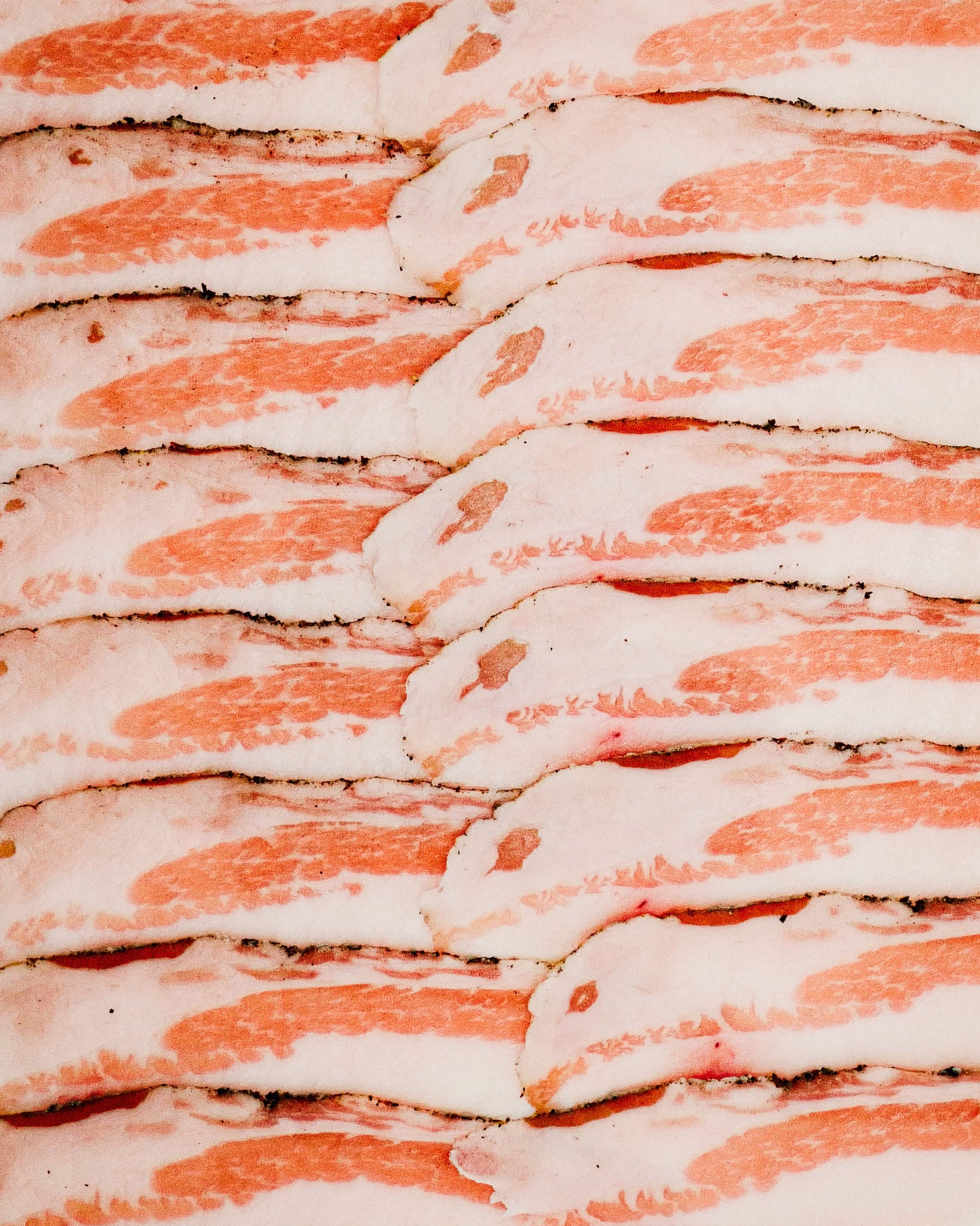 Close-up of sliced Guincale with a pinkish-red color.