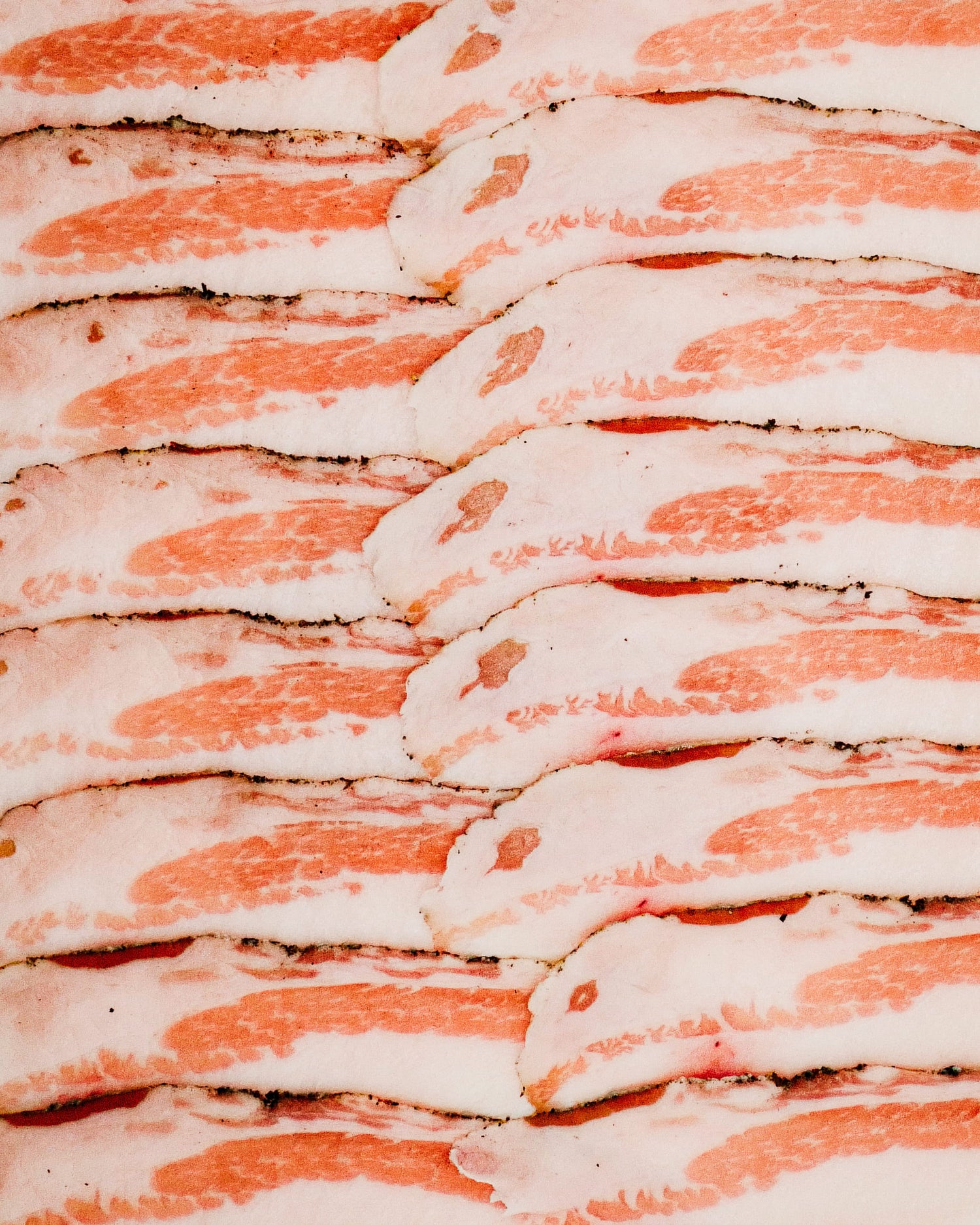 Close-up of sliced Guincale with a pinkish-red color.