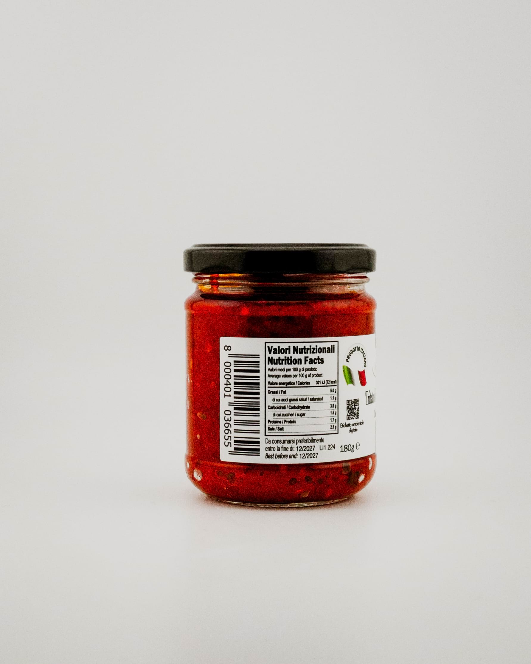 Jar of red Spicy Pate with a label on a white background