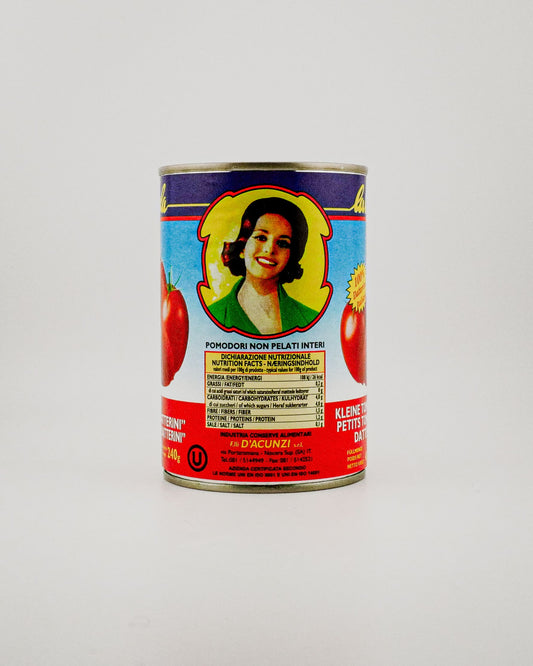 Can of tomatoes with a colorful label featuring a woman's face on a white background