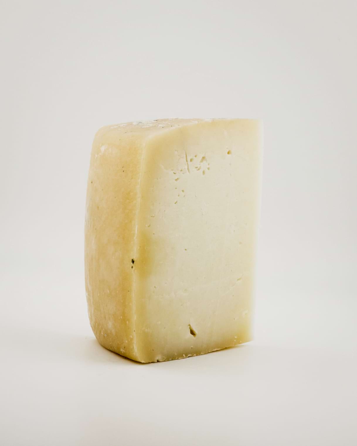 Montes Cheese sat on a white background