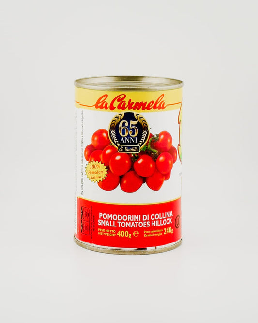 Hill tomatoes in a tin on white background