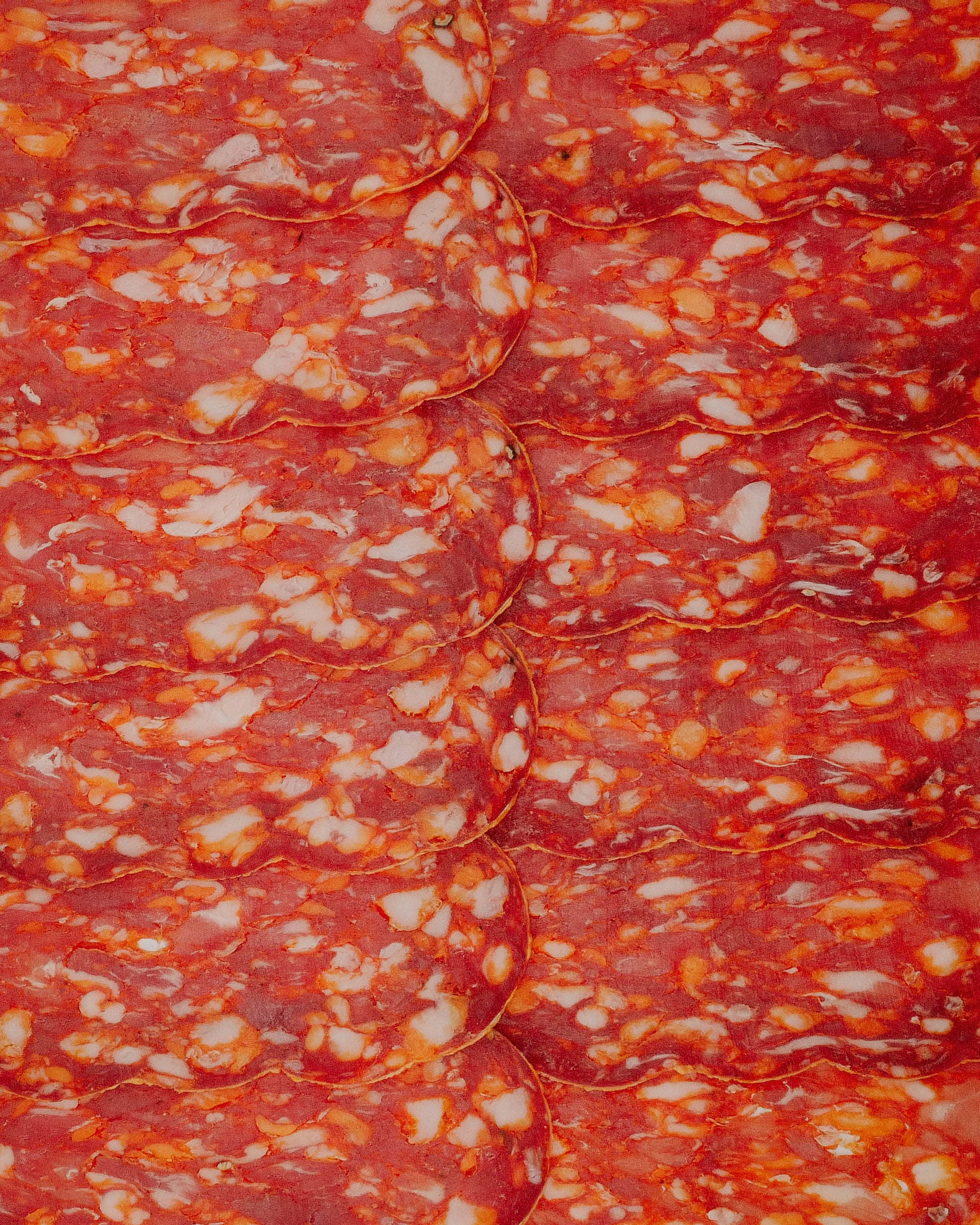 Close-up of a Spicy Salame with red and white colors.