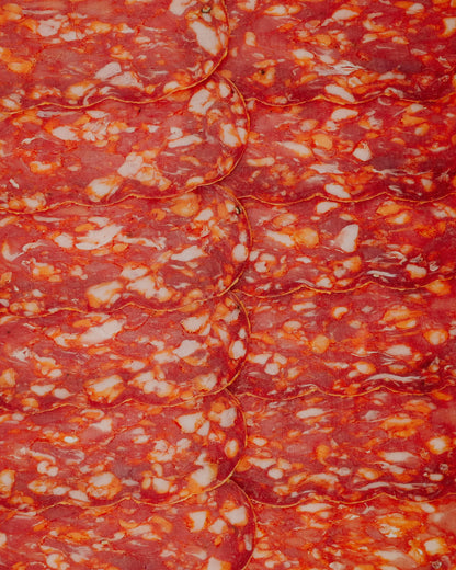Close-up of a Spicy Salame with red and white colors.