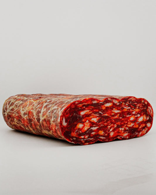 Spicy salami on a light gray background