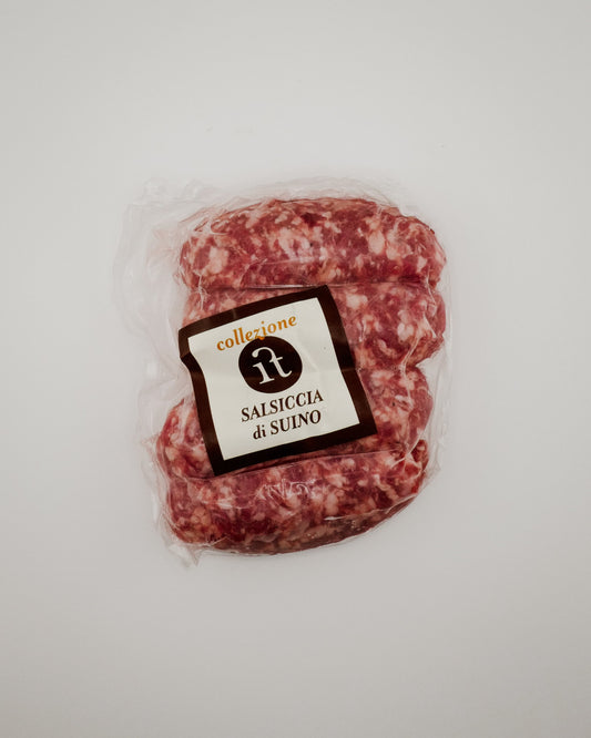 Packaged Tuscan Sausages with a label on a light gray background