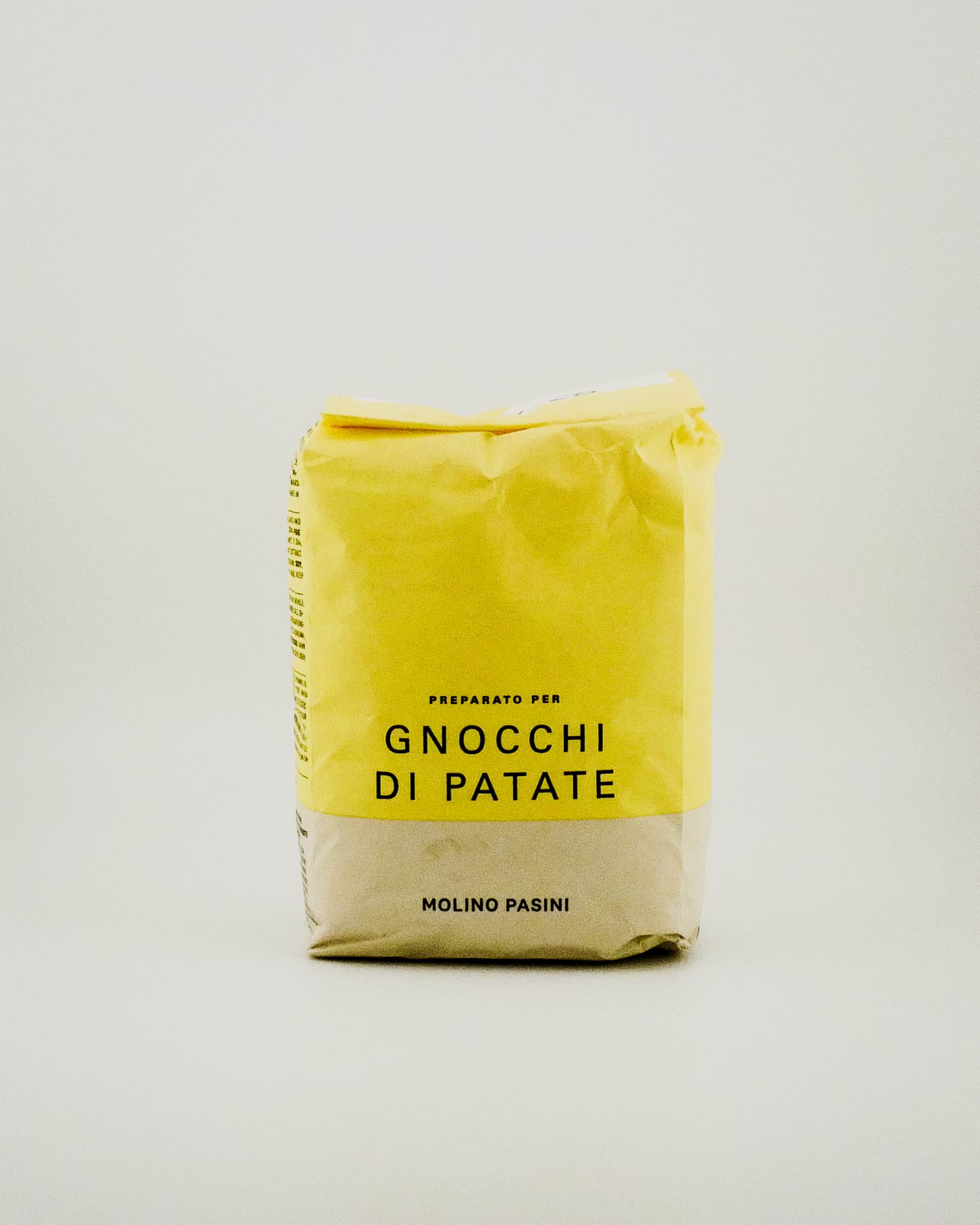 Yellow package of 'Gnocchi Di Patate' with text on a light gray background
