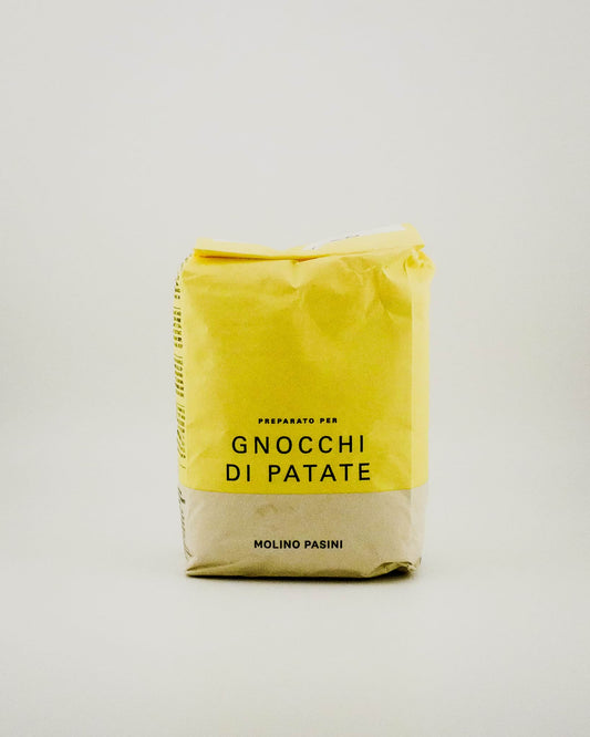 Yellow package of 'Gnocchi Di Patate' with text on a light gray background
